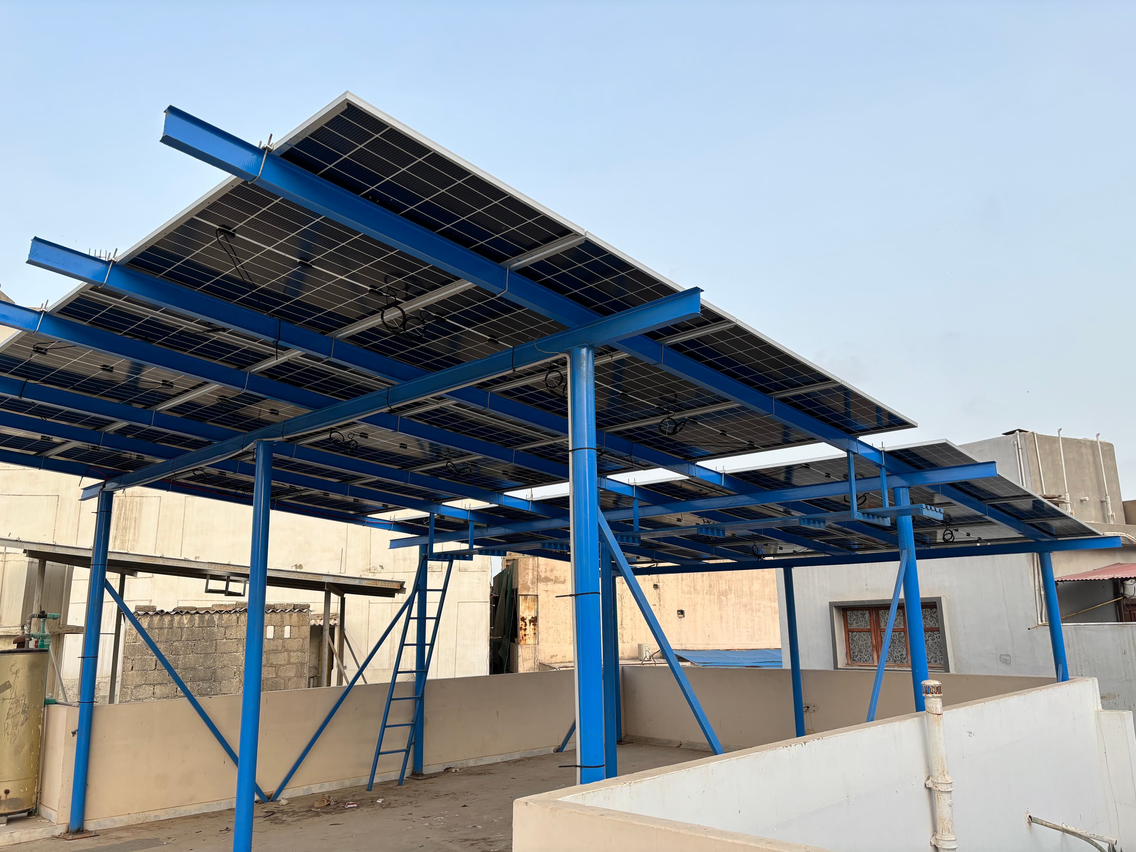 APC Solar elevated steel solar structure feeding a battery-backed home in Karachi