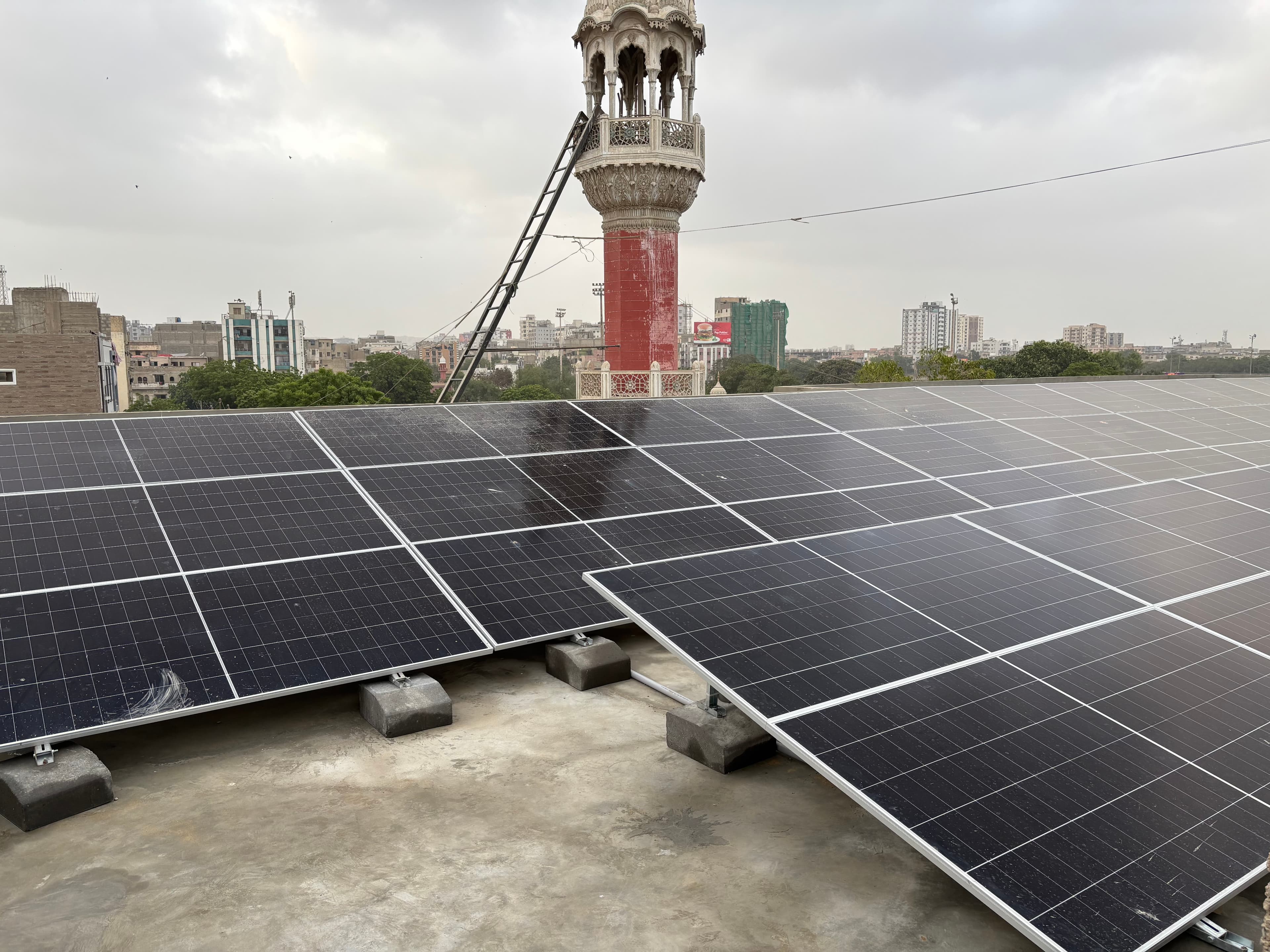 Grid-tied rooftop solar array installed by APC Solar on a Karachi home